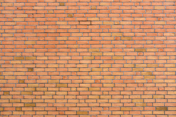 Background from a wall made of orange clinker bricks