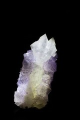 A stunning crystal formation with a mix of translucent white and purple hues, set against a black background. The crystal appears to have sharp edges and a unique structure, showcasing natural beauty.