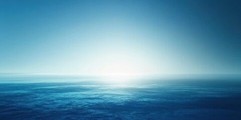 Obraz premium A Vivid Blue Horizon with a Glimmering Sun Above the Ocean