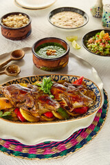 A closeup of a Fried Stuffed Pigeons dish on a rustic white surface