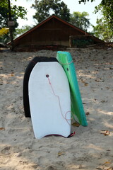 Three standing arranged children's surfboards 