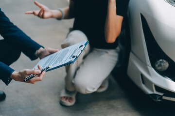 A young businesswoman is navigating car insurance options at her desk, considering premiums, deductibles, and coverage while understanding policies and managing claims efficiently.