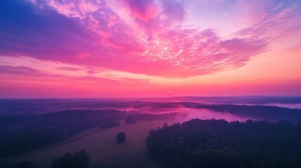 Fototapeta premium Dawn's embrace over vibrant forest panorama, captured by drone.