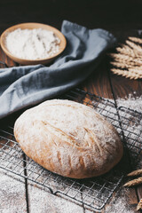 Freshly baked loaf of homemade bread on the grill