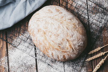 Freshly baked loaf of homemade bread on the grill