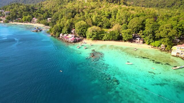 Pier Extending Over Sparkling Emerald Sea
