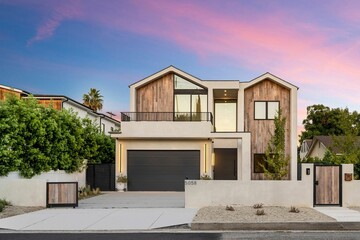 Modern house with wooden facade at sunset
