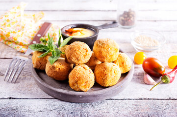fried organic falafel balls on white wooden table