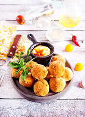 fried organic falafel balls on white wooden table
