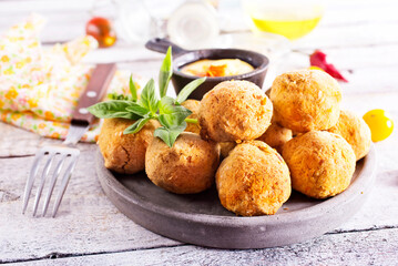 fried organic falafel balls on white wooden table