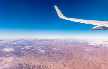 Obraz premium Aerial view on arabian desert and Red sea mountains from airplane