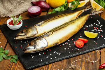 Fish. Smoked whitefish. Smoked fish on the table with toppings. Vegetables and fish. 