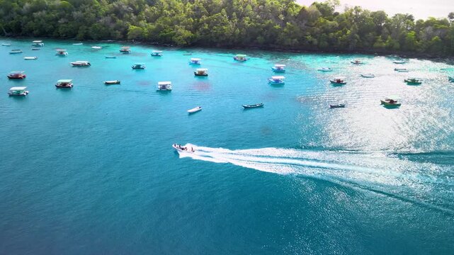 Boat Sailing by Pier with Emerald Sea and Coastal Views