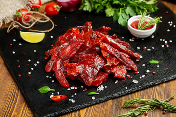 Fish. Smoked redfish. Smoked fish on the table with toppings. Vegetables and fish. 