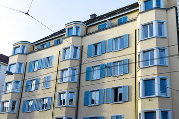 Obraz premium Yellow and blue building with tram rails in Zurich Switzerland.