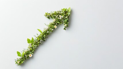 Abstract arrow pointing upwards, composed of tiny leaves and flowers, signifying natural growth and progress