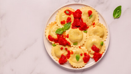 Ravioli with tomato sauce and basil