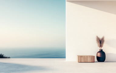 Minimalist coastal living area with decorative vase and natural elements at sunrise overlooking the ocean