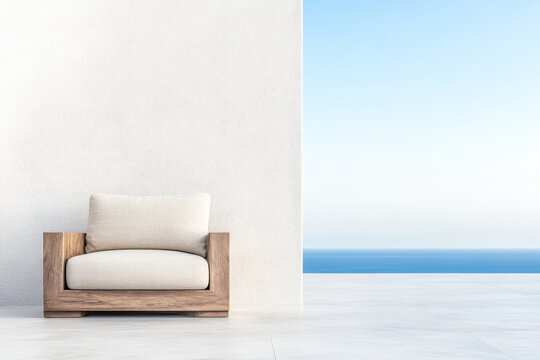 A modern wooden armchair on a serene terrace overlooking a tranquil ocean under a clear blue sky during daylight