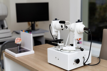 Optical equipment setup in a modern lab workspace. A specialized optical device sits on a desk in a modern lab, highlighting precision instruments for scientific research.