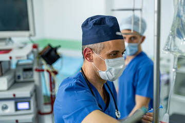 Night shift hospital medical staff. Two healthcare workers focus on patient care in a hospital...