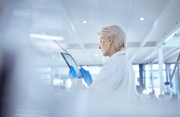 Mature scientist, tablet and medical research in chemistry lab for science experiment in...