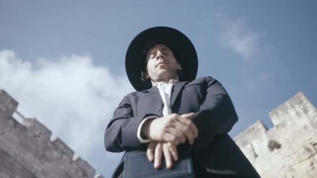 Orthodox Jewish man performing prayer