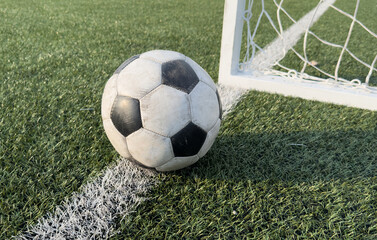 Soccer Ball with Blurry Goalpost in the Background