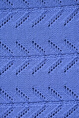 macro texture of purple crocheted sweater as a background, close-up of purple crocheted front surface, woolen texture of alpaca wool crocheted	
