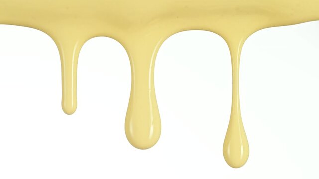 Super Slow Motion Detail Shot of Slowly Dripping Fresh Vanilla Cream Isolated on White at 1000fps.