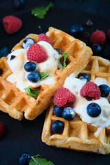 still life Belgian waffles on dark background