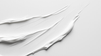 Realistic white concealer brush stroke isolated on a clean white background, ideal for beauty and makeup design with ample copy space.