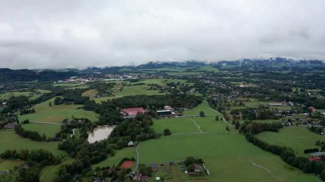 Drone shot of mist and clouds over village in czech
