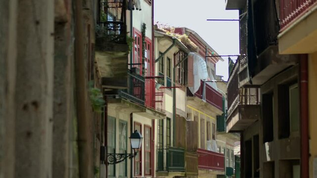Some balconies by a narrow street in Porto, Portugal.
