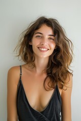 Fototapeta premium beautiful blonde woman smiling in a carefree, natural outdoor setting. Her confident smile and glowing skin reflect joy and relaxation.