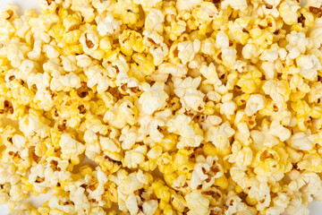 Salty popcorn on bright color background. Cinema and entertainment concept. Movie night with popcorn. Delicious appetizer, snack.Space for text, copy space. Banner