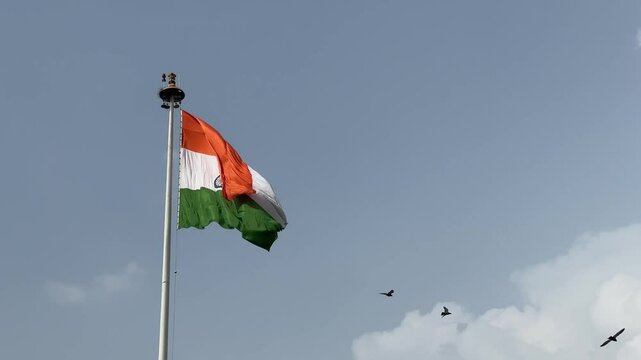 4k clip of Indian flag flying in sky with pride. Celebrate the Independence day and republic day of indian with indian flag.
