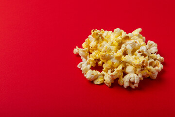 Salty popcorn on bright color background. Cinema and entertainment concept. Movie night with popcorn. Delicious appetizer, snack.Space for text, copy space. Banner