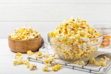 Salty popcorn on bright color background. Cinema and entertainment concept. Movie night with popcorn. Delicious appetizer, snack.Space for text, copy space. Banner