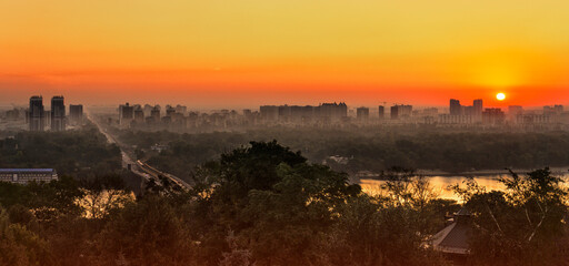 KYIV, UKRAINE Sunrise. View of the left bank of Kyiv and the Dnipro
