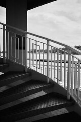Fototapeta premium twisted metal stairs in harsh light