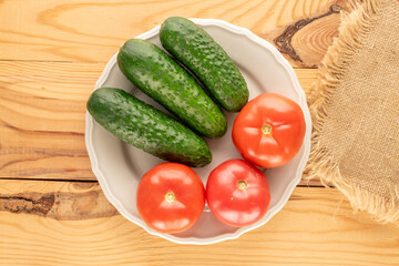 Fresh ripe vegetables on wooden table, macro, top view.