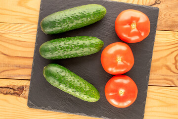 Fresh ripe vegetables on wooden table, macro, top view.