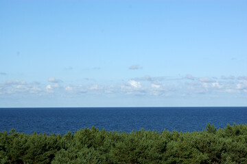 horizon of Baltic blue sea over the forest