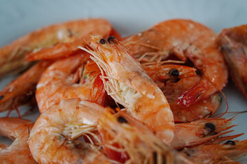 Boiled shrimps on a plate. Close-up.
