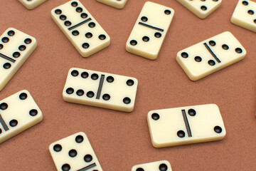 Dominoes bones on brown background	