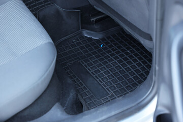 Black rubber car floor mat in auto