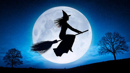 A witch flies on a broom against the backdrop of a full moon
