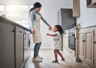 Dance, love or smile with mother and daughter in kitchen of home together for bonding or playful...