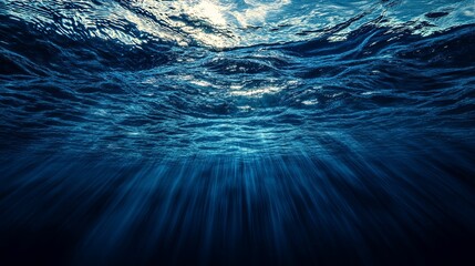 Underwater View of Sunbeams Shining Through Ocean Waves